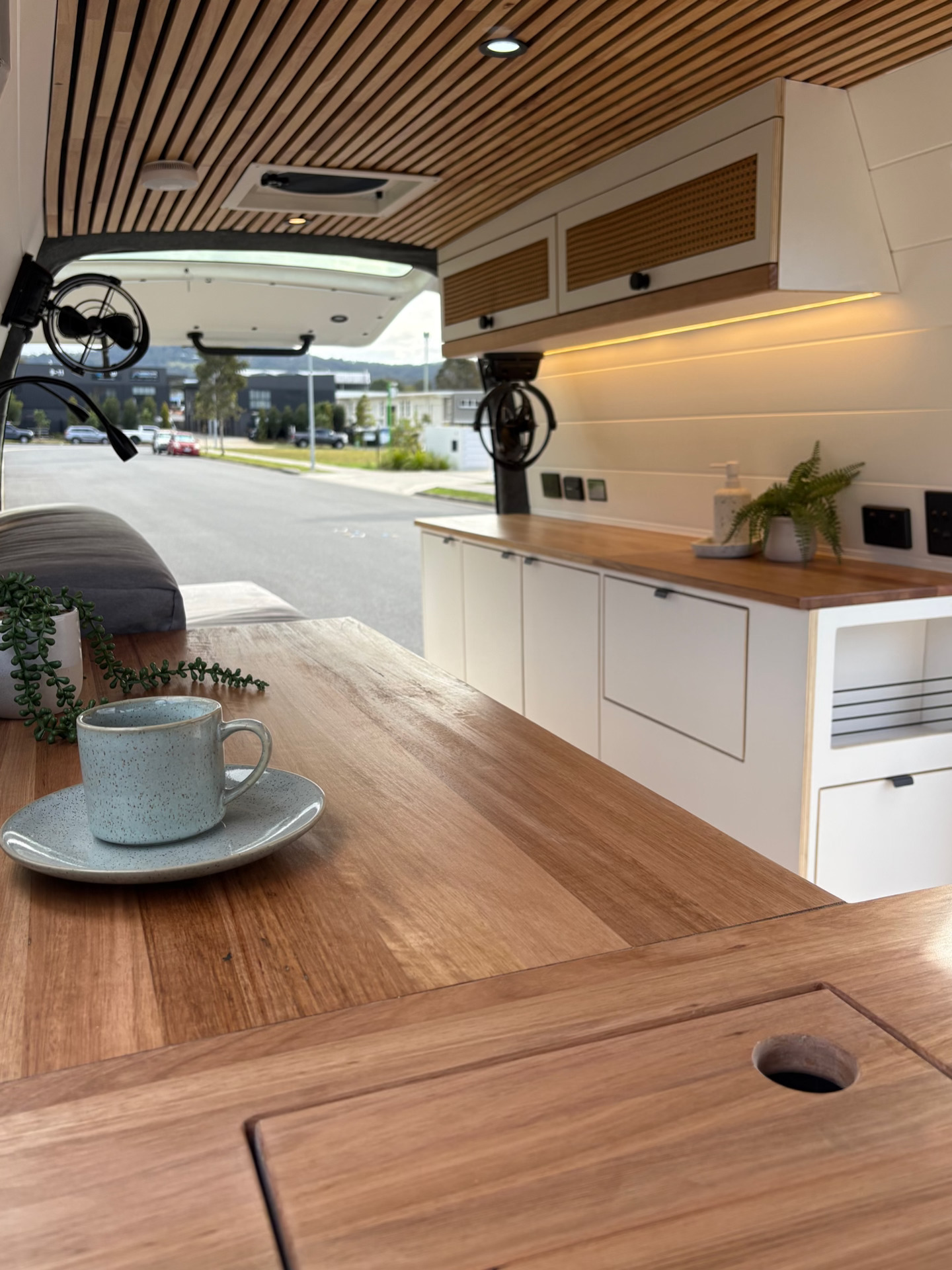 White cabinetry with wood countertops